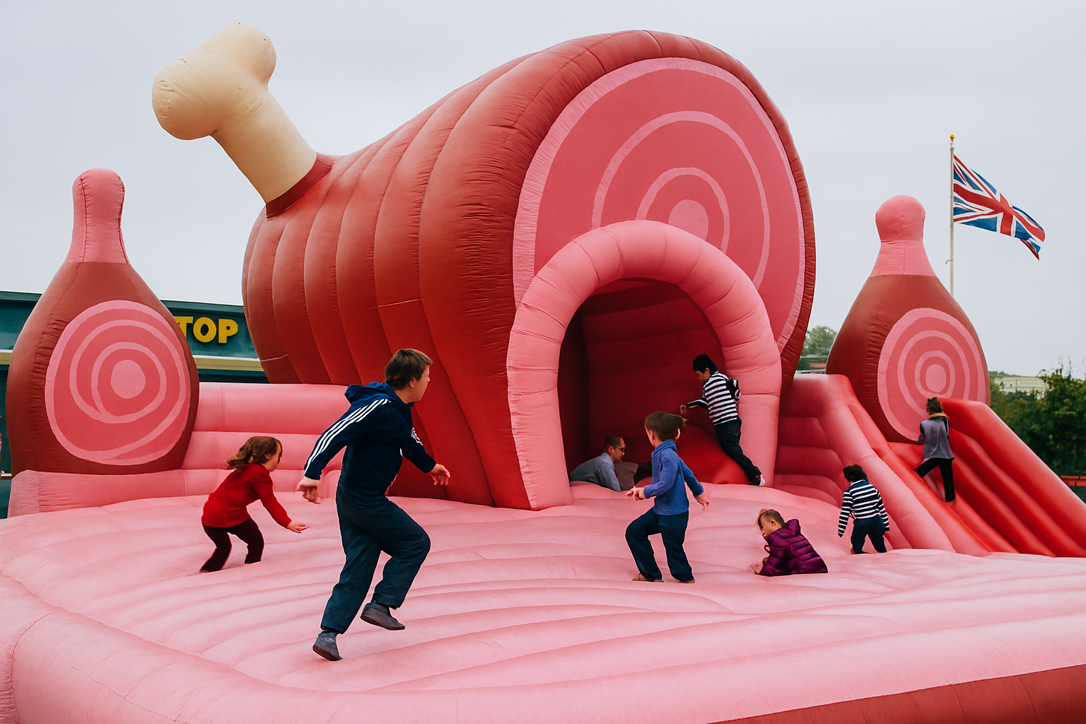 Giant ham-shaped bouncy castle with spiral pattern